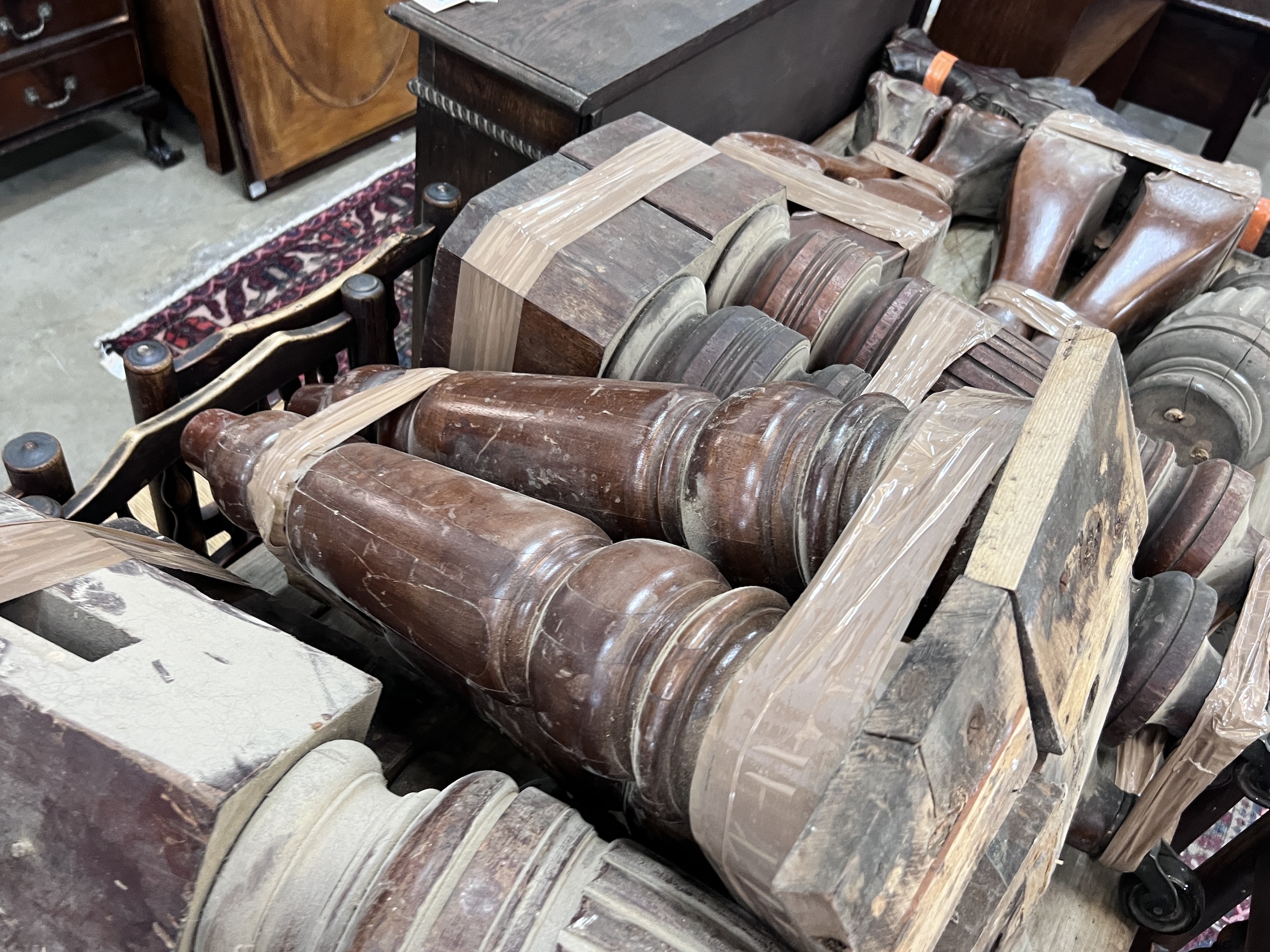 Seven sets of Victorian and later mahogany table legs, tallest 79cm